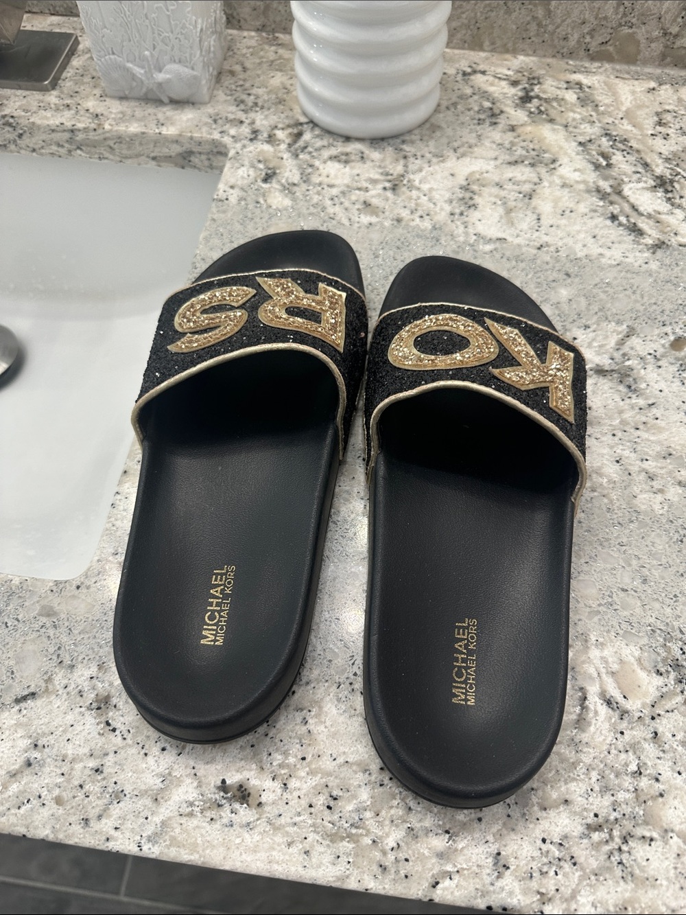 Michael Kors Black Slides with Gold Glitter 'KORS' Logo - Picture 2 of 3